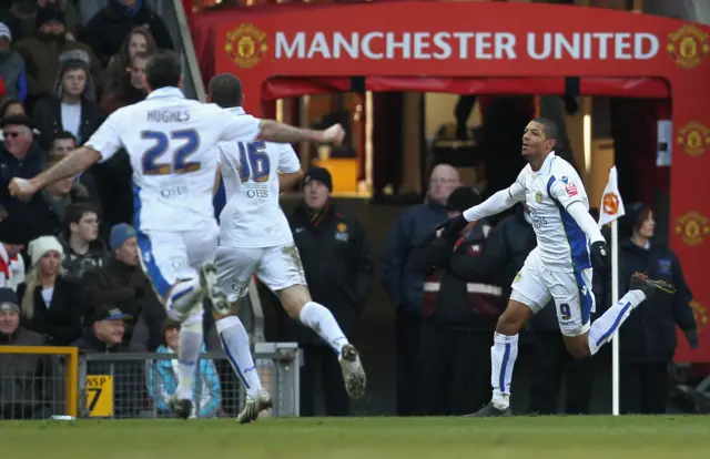 Jermaine Beckford celebrating scoring for Leeds at Old Trafford in 2010