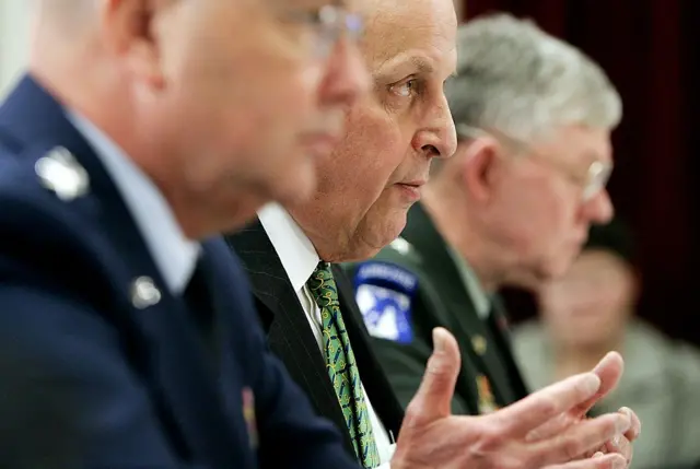 National Intelligence Director John Negroponte (C) testifies during a hearing before the House Intelligence Committee with Central Intelligence Agency Director Michael Hayden (L) and Defense Intelligence Agency Director Michael Maples (R) January 2007