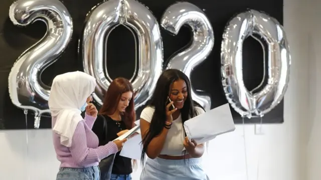 Students react as they check their GCSE results at Ark Academy, amid the spread of the coronavirus disease (COVID-19), in London,