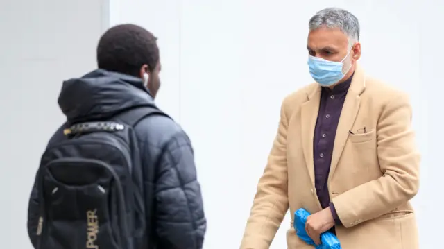 A man wears a face mask in Bradford