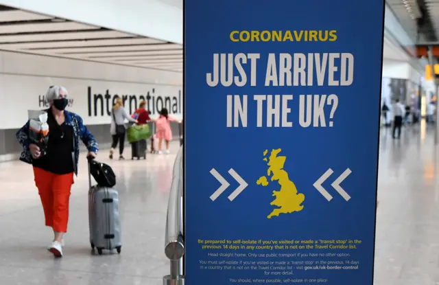 Travellers arrive at Heathrow Airport