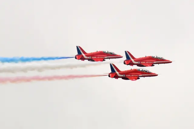 Three Red Arrows jets flying