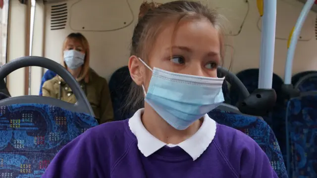 A child wearing a face mask