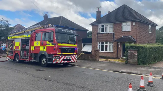 Fire engine outside house