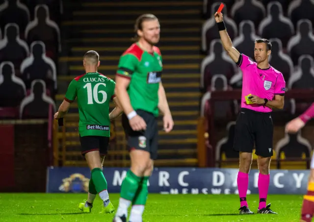 Seanan Clucas is sent off after earning a second yellow card