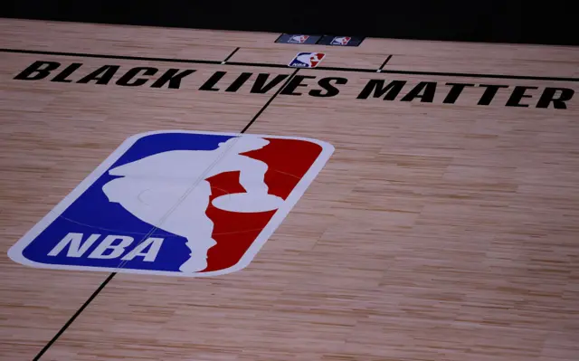 The NBA court reads "black lives matter"