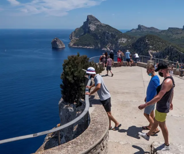 People visit the Es Colomer viewing point in Formentor, Majorca,