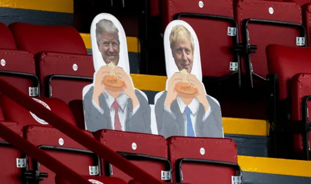 Cardboard cutouts of Donald Trump and Boris Johnson