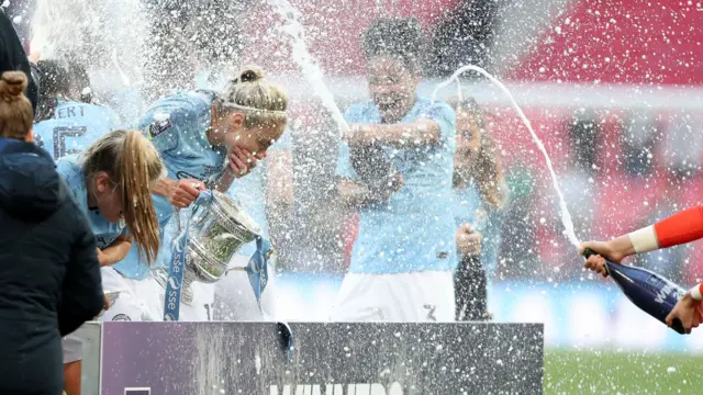 Manchester City celebrate with the FA Cup