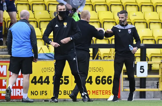 Gary Holt and Stuart Kettlewell touch fists in a Covid-19 safe manner