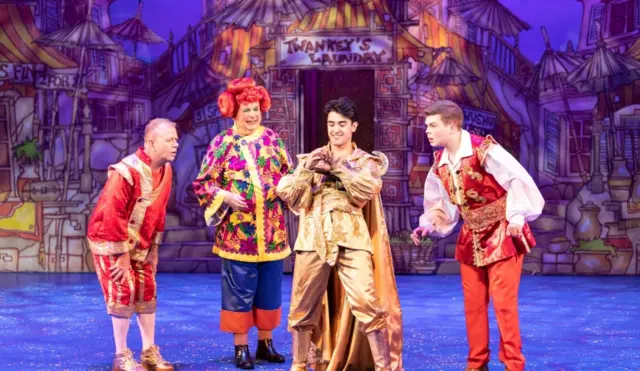 Rikki Jay (Wishee), Christopher Biggins (Widow Twankey), Yazdan Qafouri (Aladdin) and Max Fulham (Washee) in Aladdin at the Churchill Theatre in Bromley (December 2019)