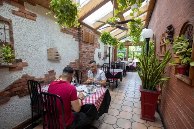 Diners at an indoor restaurant