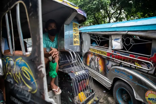 A jeepney driver wears a mask in Quezon City