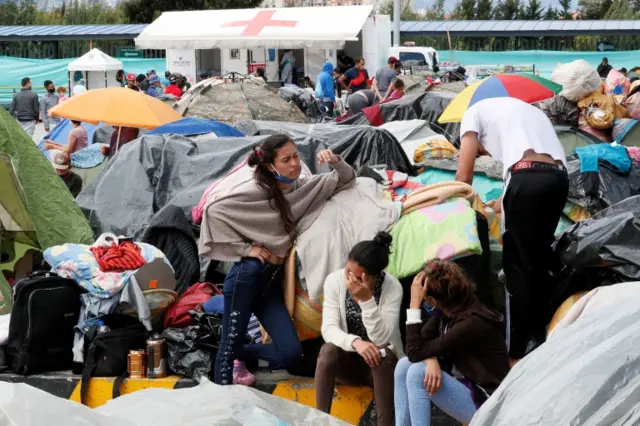 Venezuelan migrants wait at the north transport terminal in Bogota, Colombia, 03 July 2020