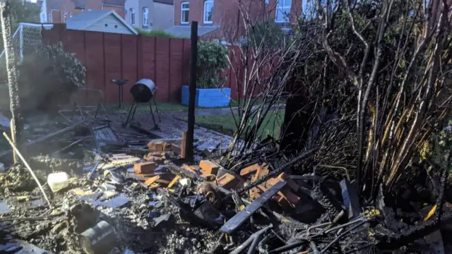 Burnt out shed after fire