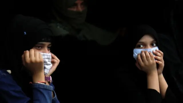 Women wear face coverings amid the spread of coronavirus, in New Delhi, India