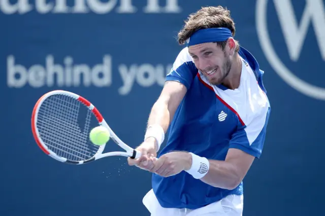 Cameron Norrie hits a backhand