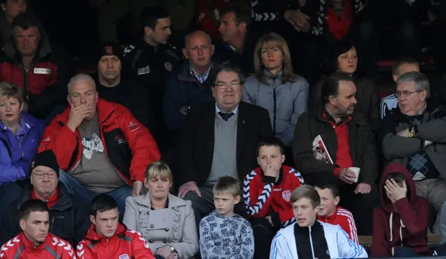 John Hume sitting in the stands for a Derry City match in 2012