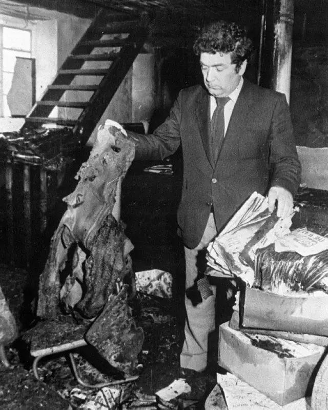 John Hume at scene of petrol bomb attack