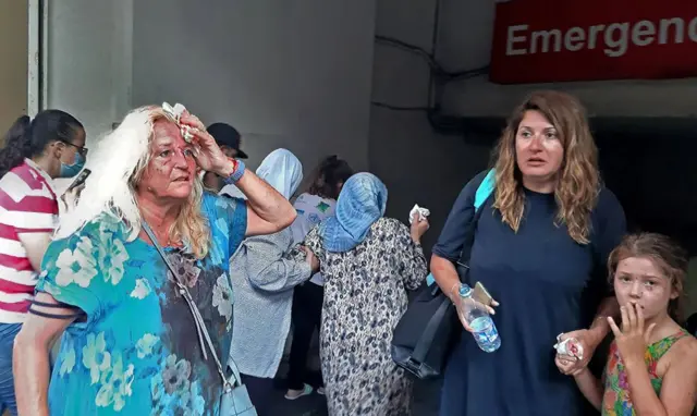 Valarie Fakhoury, a British grandmother with her Lebanese daughter and granddaughter, stand outside the emergency ward of a hospital in central Beirut