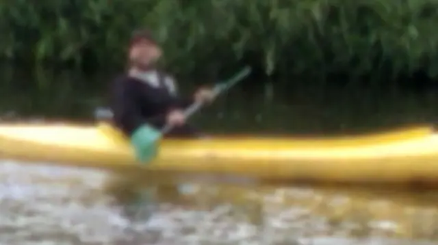 Man riding in kayak