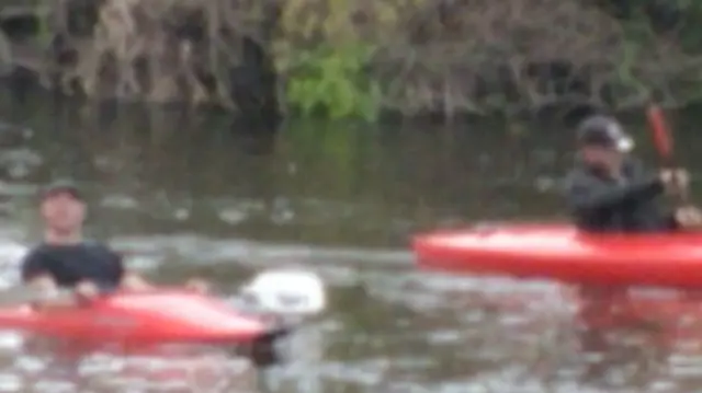 Men in kayaks