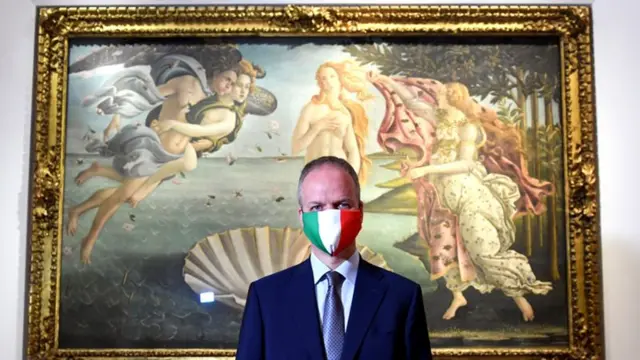 Man with Italian flag face mask