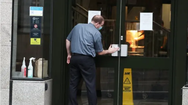 Man cleaning door