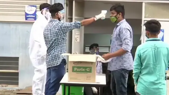 Man having his temperature taken