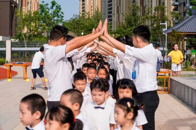 Primary school children attend a class on the first day of the new term in Wuhan, China, on September 1, 2020