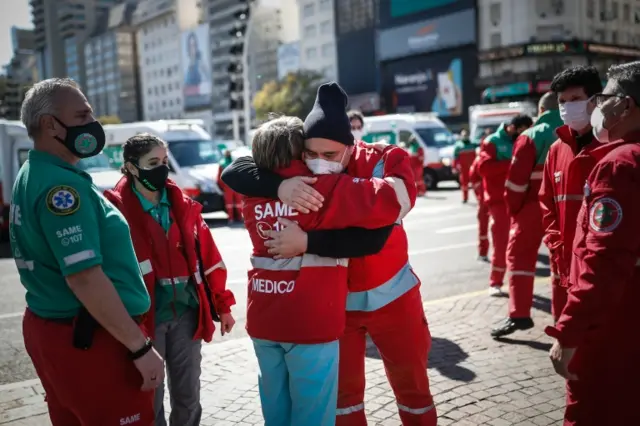 Personnel of the Emergency Medical Attention System of the City of Buenos Aires pay tribute to Dr. Juan Lobel, who died of COVID-19, in Buenos Aires, Argentina, 30 August 2020.