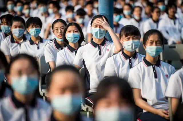 Students attend the 100th anniversary of the founding of Wuhan High School on the first day of the new semester in Wuhan in China's central Hubei province on 1 September 2020