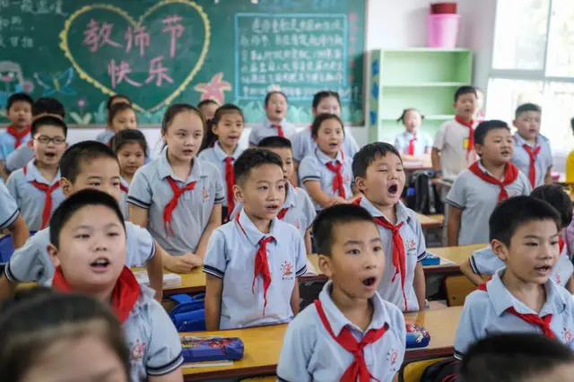 Primary school children attend a class on the first day of the new term in Wuhan, China, on September 1, 2020