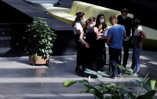 People wearing face masks are seen at work at a mega-campus for startups in Paris, France, on 31 August 2020