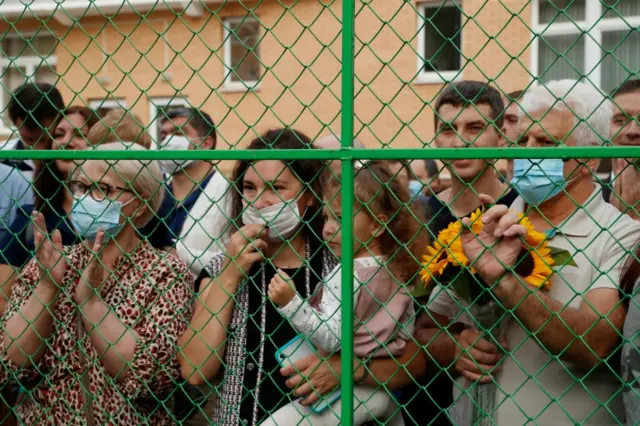 Relatives watch as first graders attend a ceremony marking the start of the new school year, as schools reopen after the summer break and the lockdown due to the outbreak of the coronavirus disease (COVID-19), in Moscow, Russia, ON 1 September 2020