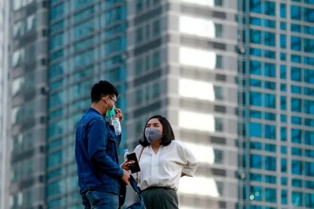 People wearing protective face masks are seen at the park amid the coronavirus disease (COVID-19) outbreak, in Jakarta, Indonesia, August 22, 2020