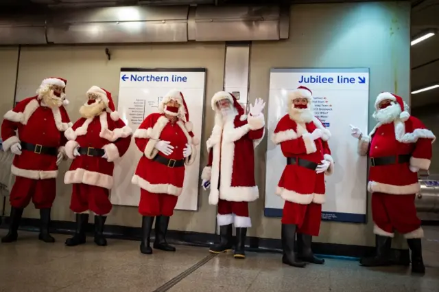 Members of the socially distant santa school travel to Southwark Cathedral, London