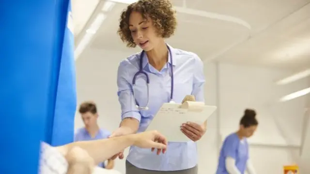 A doctor seen on a ward