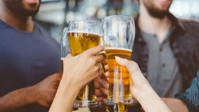 People with beer in glasses