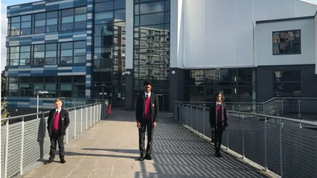 Pupils outside a school