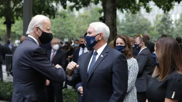 Democratic presidential candidate and former U.S. Vice President Joe Biden and Vice President Mike Pence greet each other at the 9/11 memorial ceremony