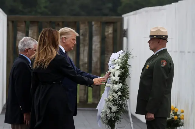 US President Donald Trump and first lady Melania Trump place a wreath during a ceremony at the Flight 93 National Memorial