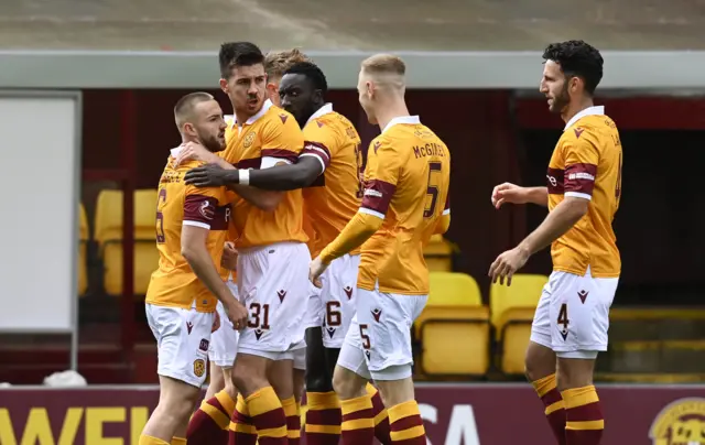 Allan Campbell celebrates after firing Motherwell in front