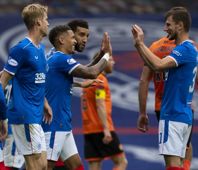 Rangers celebrate one of their four goals in the victory against Dundee United