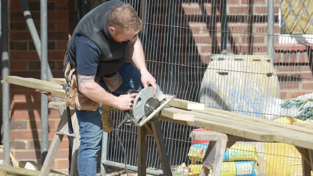 A person working on a house