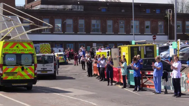 Hospital staff applauding