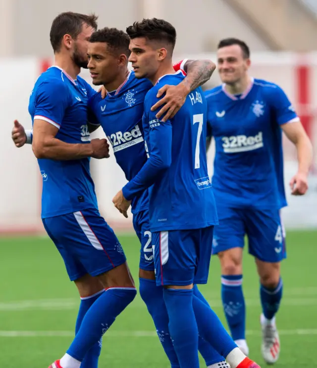 James Tavernier celebrates with Ianis Hagi