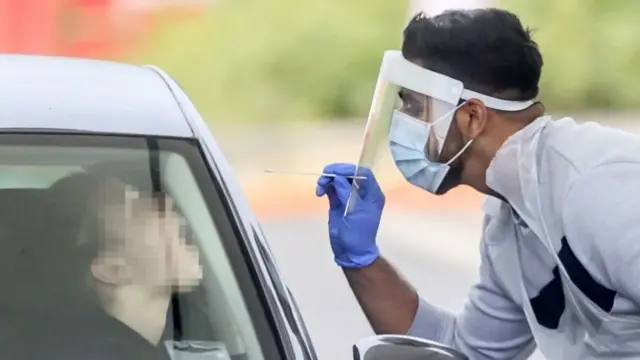 Staff working at a Coronavirus testing centre at Temple Green Park and Ride in Leeds on 16 September 2020