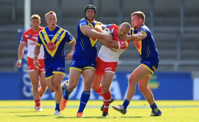 St Helens' James Roby in tackled against Warrington