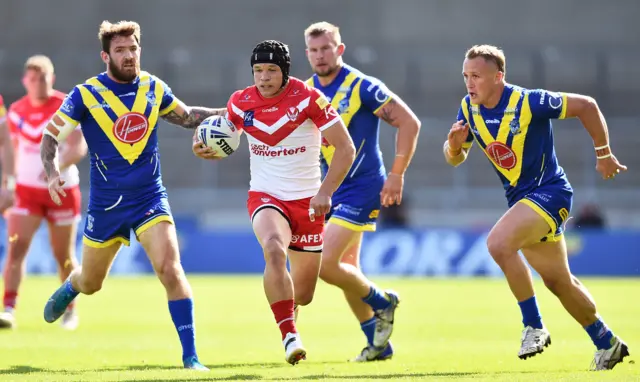 Jonny Lomax of St Helens breaks through the defense